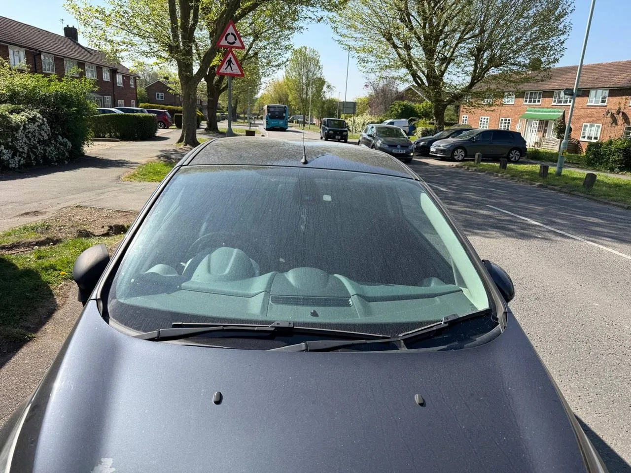 A vehicle receiving mobile windscreen work outside a London home